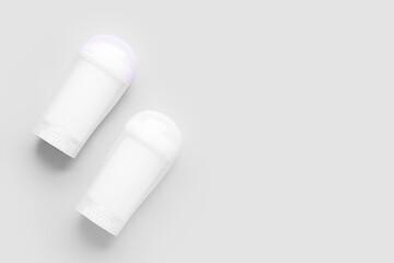 Two deodorant bottles on white background