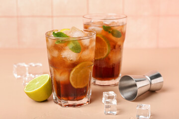 Glasses of cold Cuba Libre cocktail on table