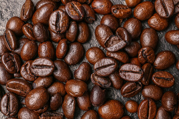 Coffee beans on dark grunge background, closeup
