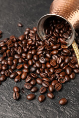 Pot with coffee beans on dark grunge background