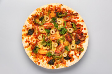 Vegetable pizza on grey background