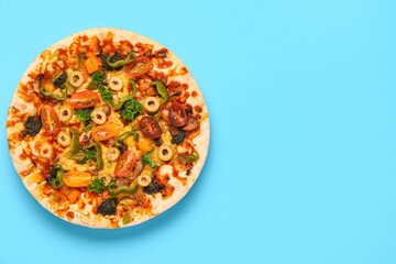 Vegetable pizza on blue background