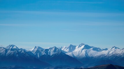A mountain range with snow-capped peaks and a blue sky. Generative AI 