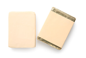 Processed cheese in foil isolated on white background