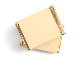 Processed cheese in foil isolated on white background