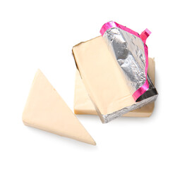 Processed cheese in foil isolated on white background