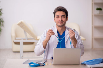 Young male doctor otologist working in the clinic