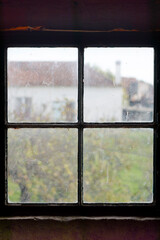 antique window with rural landscape in vintage scenery 
