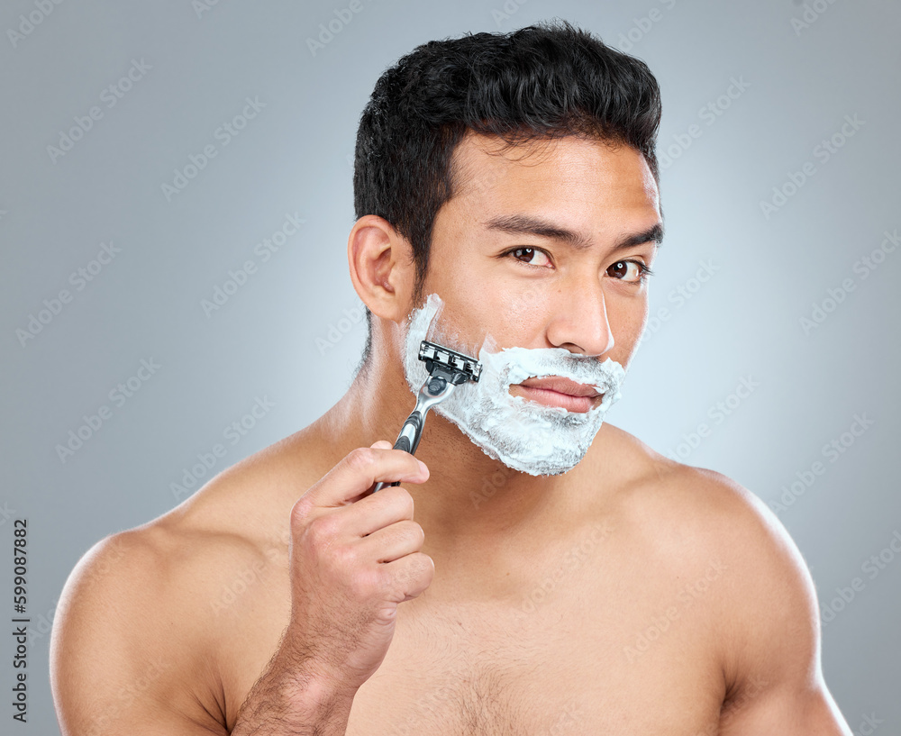 Poster Be gentle and let your razor do the work. Studio shot of a man shaving with a disposable razor.