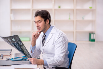 Young male doctor radiologist working in the clinic