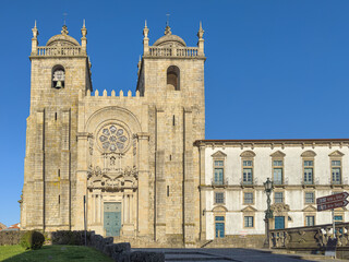 Fototapeta na wymiar Front of the Romanesque Porto Cathedral (Se do Porto). The Porto Cathedral is a popular tourist attraction of Portugal. The historic centre of Porto was designated a UNESCO World Heritage site