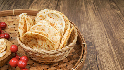 Tempe or Keripik Tempe. Tempeh chips a typical Indonesian food. It's served on bamboo basket