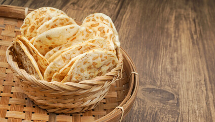 Traditional indonesian culinary food. Tempe Chips over wooden background