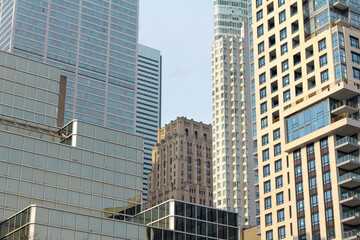 Skyscrapers of various sizes and ages (from the 30's till the 2000's) in downtown Torono, Ontario, Canada during a sunny winter afternoon