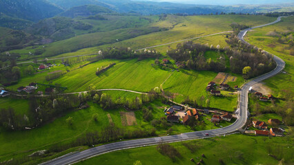 Curved road, Apuseni mountains, Romania. Top aerial photography.