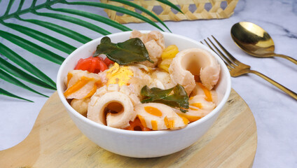 Indonesian street food cuisine, seblak in white table, over marble table