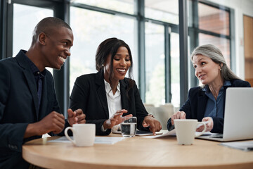 Action gets the wheels of profit spinning. a group of businesspeople having a meeting in a modern office.