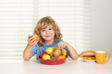 Fototapeta na wymiar Kid eating apple. Child eats organic food. Healthy vegetables with vitamins. Proper kids nutrition concept.