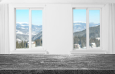 Fototapeta na wymiar Empty grey surface against windows indoors. Space for design