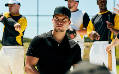Coaching is his calling. a handsome young baseball coach looking thoughtful while standing on the field during the day.