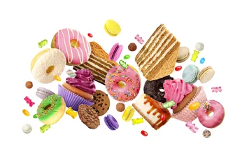 Foto op Canvas Many delicious sweets falling on white background © New Africa