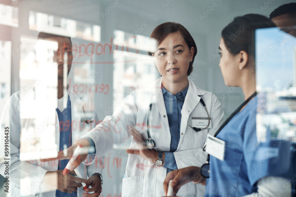Poster great minds think alike. shot a group of doctors discussing formulas in the office at work.