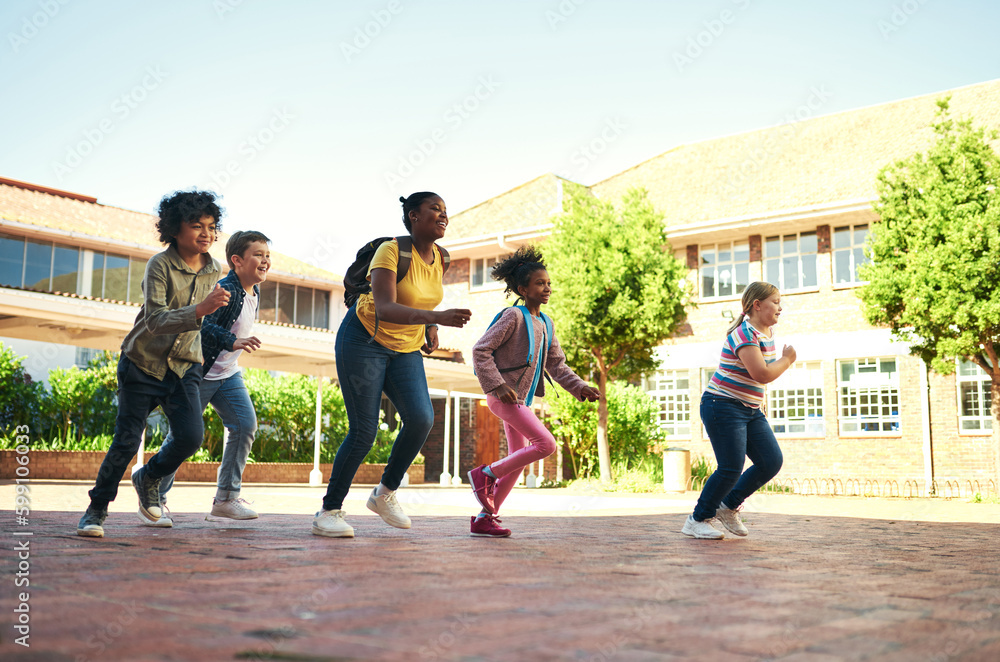 Poster race you back to class. full length shot of a diverse group of children running outside during reces