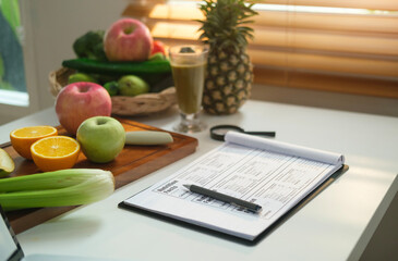 Sheet of diet plan and different healthy food ingredients on white table. Dieting, healthy lifestyle and right nutrition concept. - obrazy, fototapety, plakaty