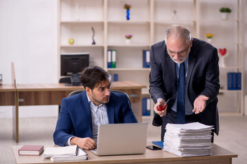 Two male colleagues working in the office