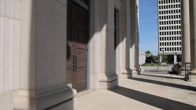 Columns and doors at the Mississippi state Supreme Court building in Jackson, Mississippi with video panning right.