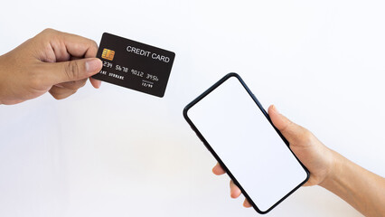 Online payment Concept. Woman using credit card with mobile phone for shopping online on white background