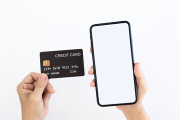 Online payment Concept. Woman using credit card with mobile phone for shopping online on white background