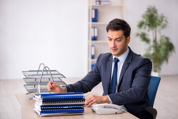 Young male employee working in the office