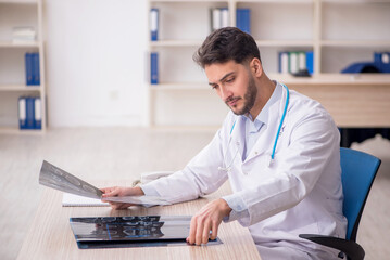 Young male doctor radiologist working in the clinic