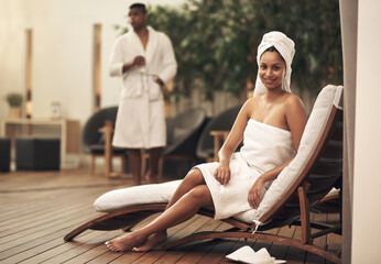 Youd be amazed at how beneficial a spa day can be. a woman wearing a towel around her head while enjoying a spa day.
