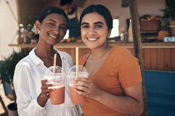 Building healthy habits together. two friends enjoying smoothies together.