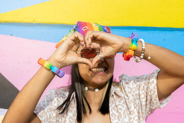 Love is Love: Woman Showing Rainbow Heart Sign Outdoors