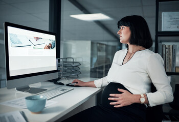 Pregnancy wont be the reason I slow down. an attractive pregnant businesswoman sitting in her...