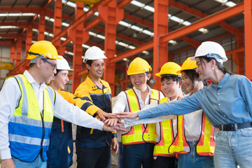 industrial meeting hold hand over team building. Happy engineer Holding Hands Standing In Circle During Corporate Teambuilding Meeting In factory Celebrating Business Success. 