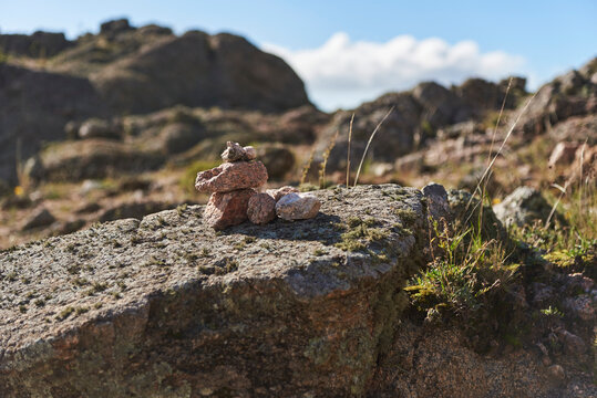 Pirca, pile of stones that serve as trail marker for hikers to follow the correct way, in Los Gigantes, Cordoba, Argentina, a mountainous destination ideal for trekking, hiking and climbing.