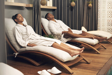 A spa treatment can be a great bonding experience. a young couple spending the day together at a...