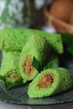 dadar gulung are a typical Indonesian and Malaysian food which can be classified as pancakes filled with grated coconut mixed with liquid palm sugar. Kuih ketayap, kuih lenggang, kuih dadar