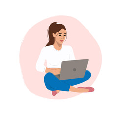 Women sitting and working online with grey laptop