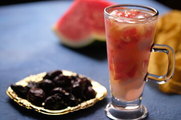 Es Buah is a fresh fruit drink made from shavings of melon, cantaloupe, young coconut, and sliced watermelon. Ramadan takjil. Indonesian food. Indonesian Drinks. Ramadan dishes. Kurma Ajwah.