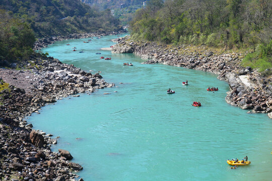 Top view of the Ganges river and rafting boats floating down it.