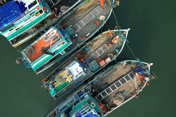 asian fisherman boat ,docks at the harbor - obrazy, fototapety, plakaty