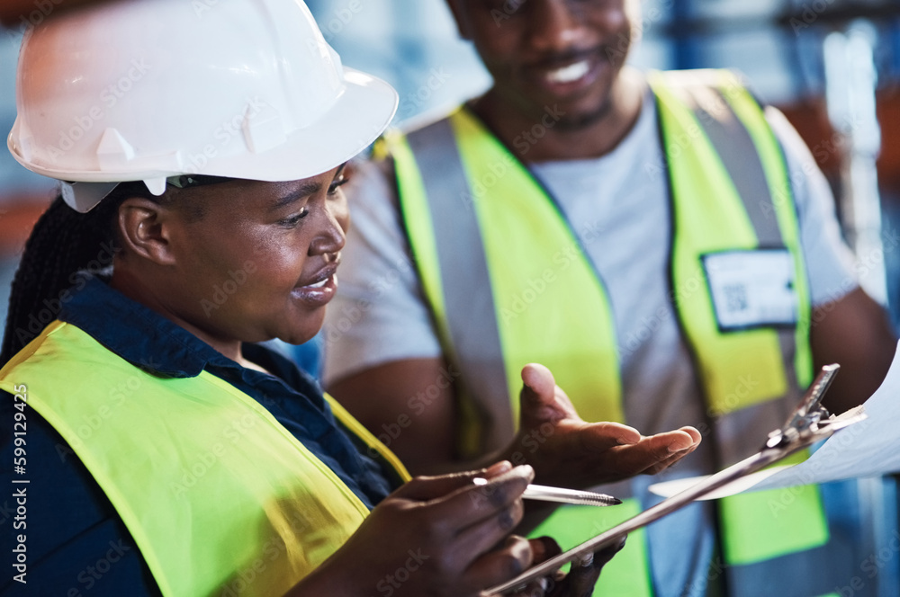 Poster where should i put these. two young contractors standing in the warehouse and having a discussion wh