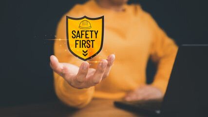 Man showing the safety banner symbol on hand. Concept of caution work hazard, danger surveillance,...