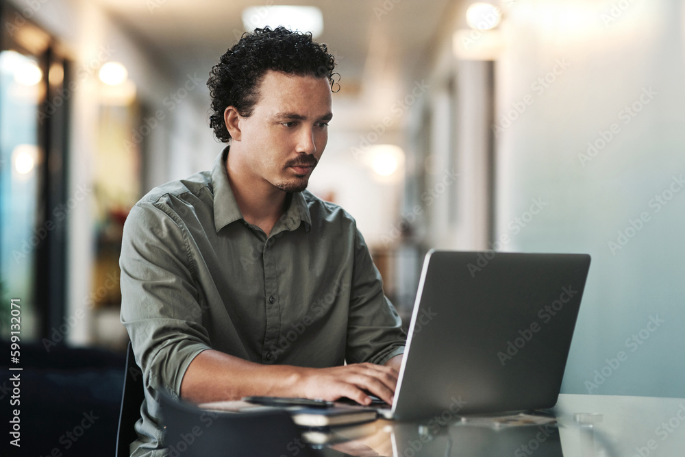 Poster one more email and then im done. a handsome young businessman sitting alone in the office and using 