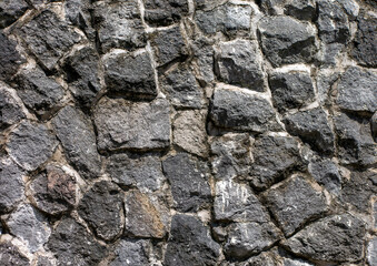 Surface of the stone wall for background and wallpaper